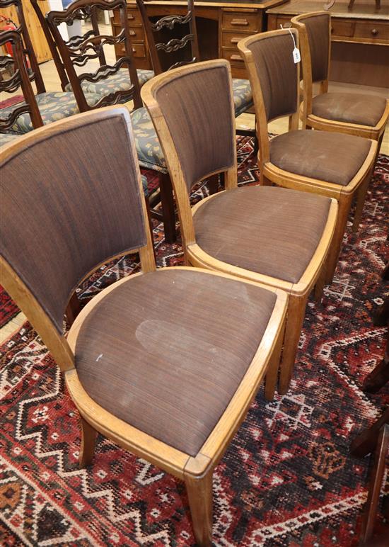 A set of four Heals oak dining chairs